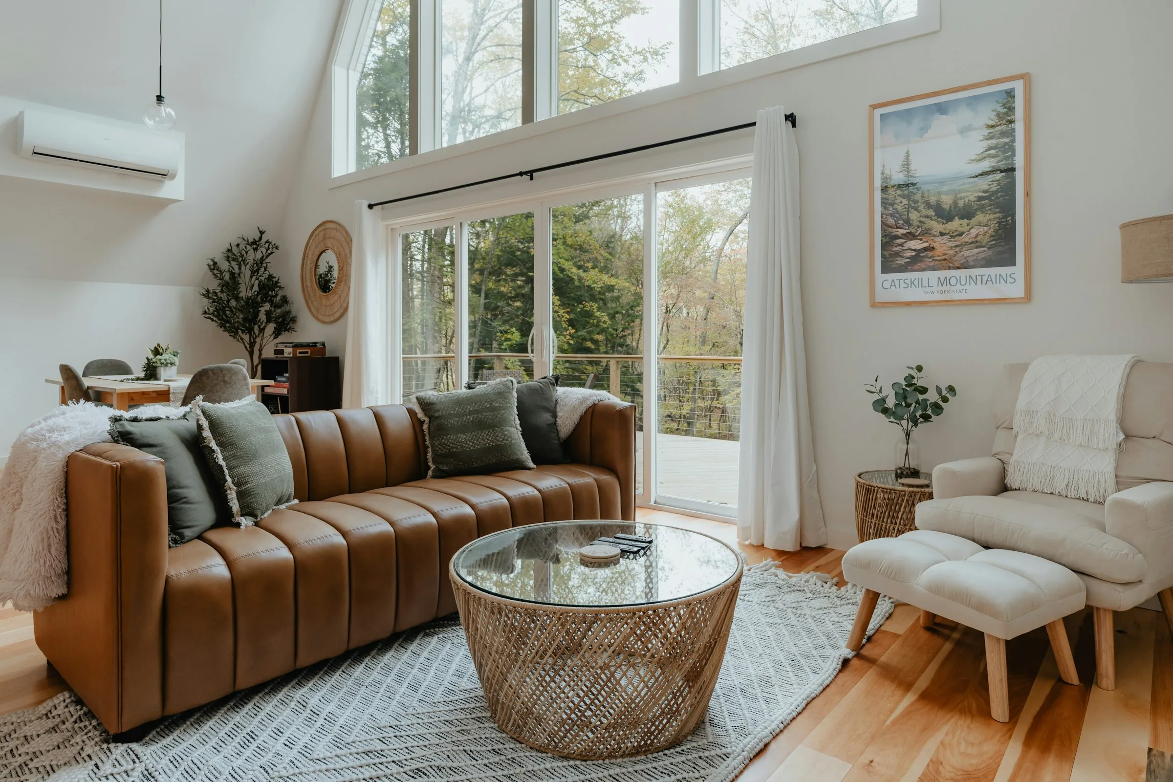 A living room with warm materials and a view outdoors